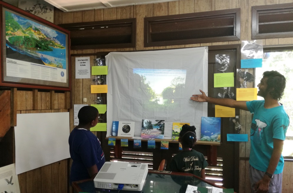 Education Officer Shaueel Persadee explains the role of Wetlands in Climate Change at the Pointe-a-Pierre Wildfowl Trust